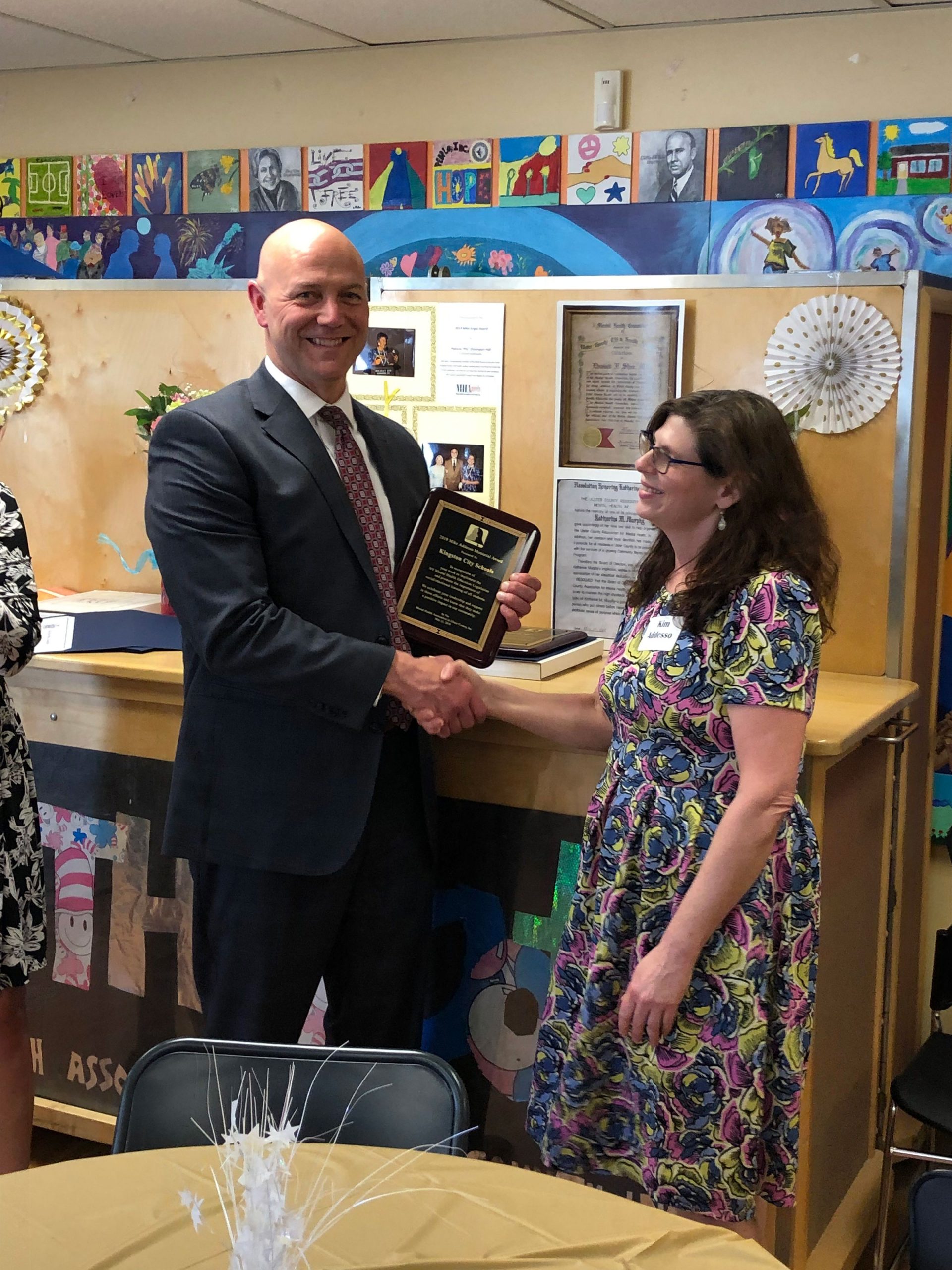 Dr. Paul Padalino receiving the Mike Addesso Memorial Award from Kim Addesso at the 2019