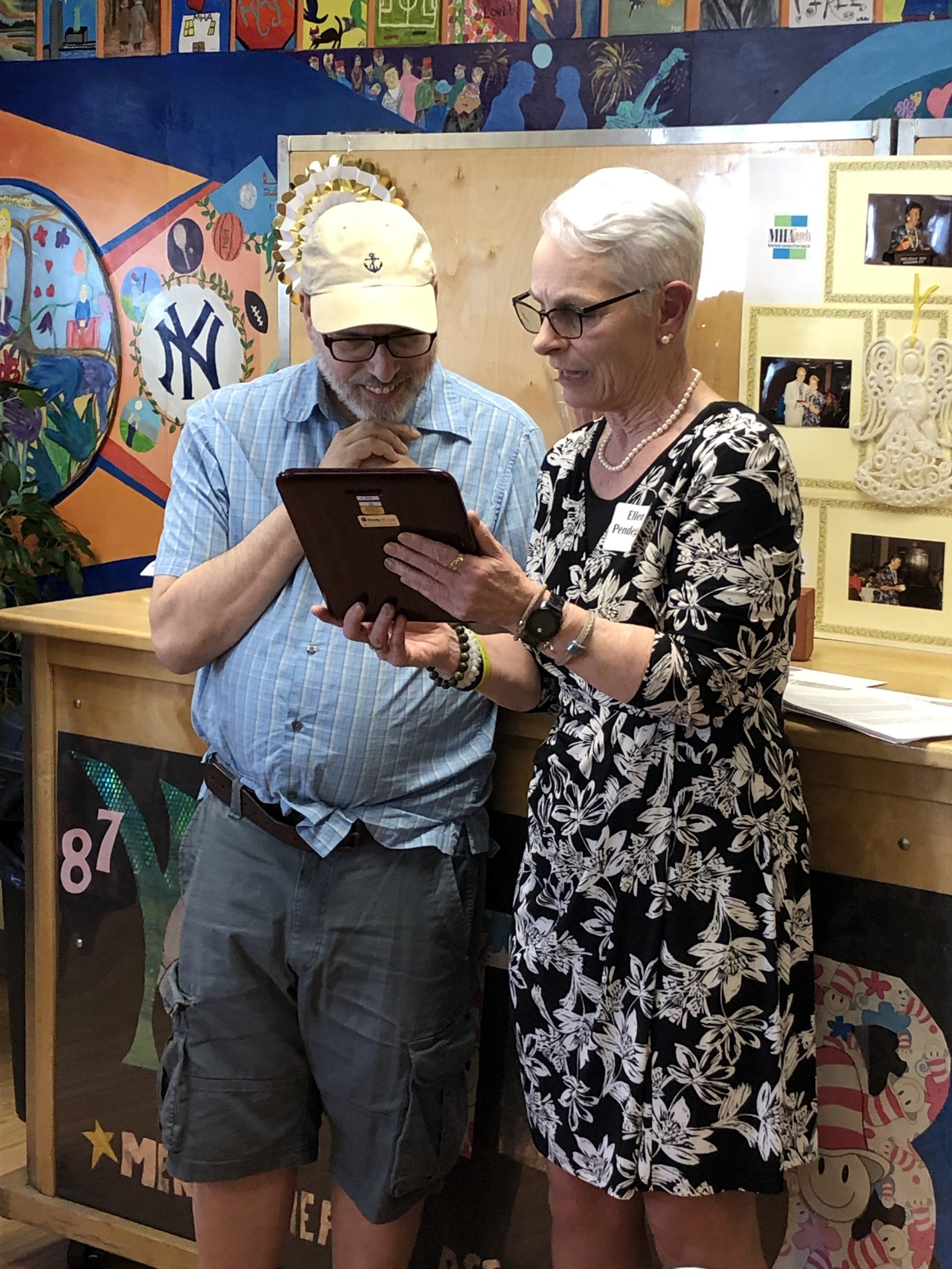MHA CEO Ellen Pendegar presenting the Harry Hall Memorial Award to Morris Bassik