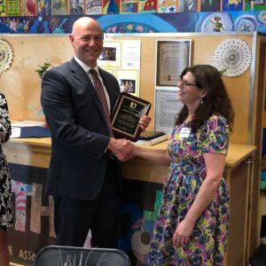 Dr. Paul Padalino receiving the Mike Addesso Memorial Award from Kim Addesso at the 2019